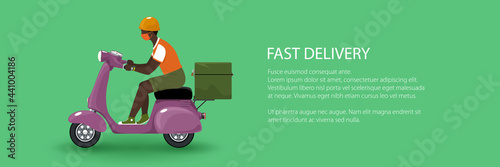 Young african guy in protective face mask with thermal bag for food delivery rides a scooter, purple vintage scooter on a green background, banner of online delivery service and stay home concept