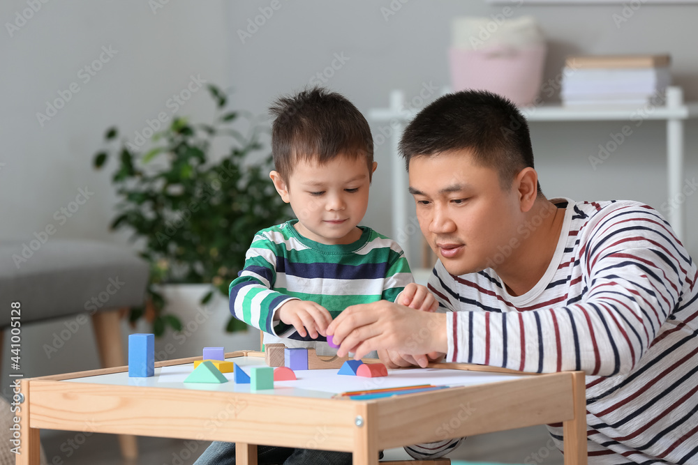 Happy father and his little son playing at home Happy father and his little son playing at home