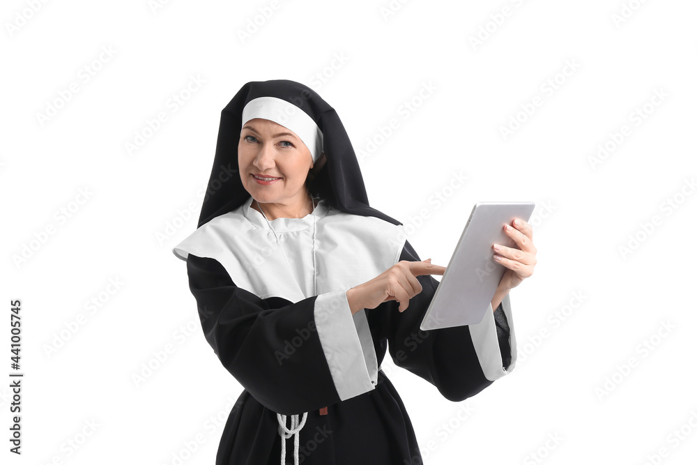 Mature nun with tablet computer on white background Mature nun with tablet computer on white background