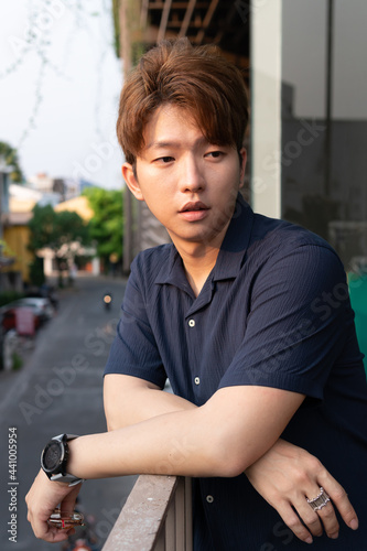 Young Asian man hair style men in navy blue shirt casual portrait. 