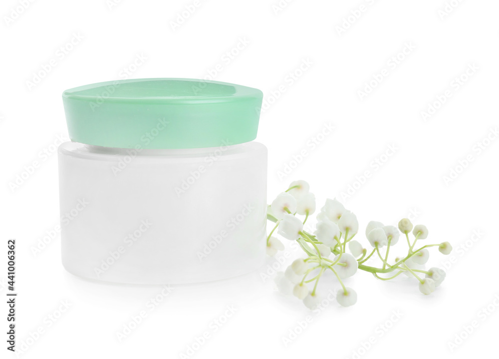 Jar of cream and lily-of-the-valley flowers on white background Jar of cream and lily-of-the-valley flowers on white background