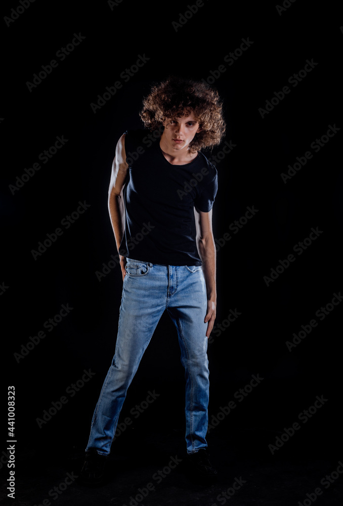 Rock guy with curly afro hair posing