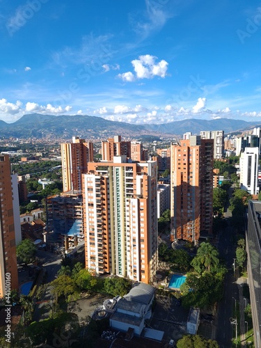 Medellin, Antioquia, Colombia. December 13, 2020: landscape with mountains and blue sky. Architecture and facade of buildings in El Poblado.