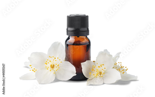 Brown glass bottle with essential oil and jasmine flowers isolated on white background. Essence liquid for skin care or alternative medicine.