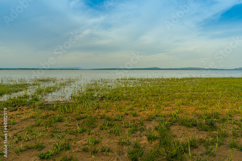 The view of the meadow and the river in the background is a mountain view using the worm s eye imaging technique at Sirindhorn Dam  Ubon Ratchathani Province  Thailand.