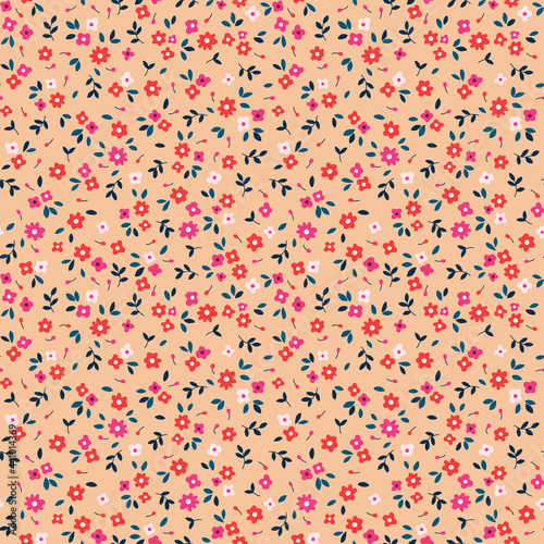 Simple cute pattern in small pink and red flowers on coral background. Liberty style. Ditsies print. Floral seamless background. The elegant the template for fashion prints.