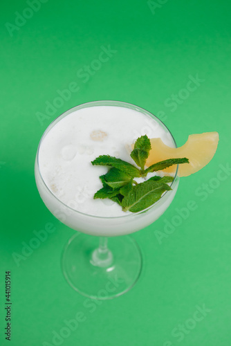 Pina Colada in front of green background