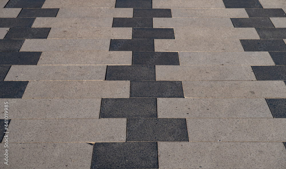 Obraz premium background or texture of stone tiles on the sidewalk