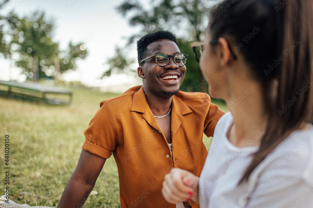 Adult man, making his girlfriend laugh. Adult man, making his girlfriend laugh.