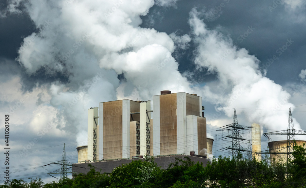 Coal Power plant with lots of smoke in the sky Coal Power plant with lots of smoke in the sky
