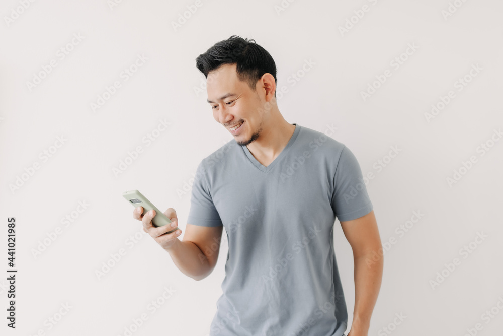 Happy Asian man use smartphone isolated on white background. Happy Asian man use smartphone isolated on white background.