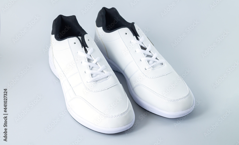 Pair of white stylish leather shoes sport style foorwear