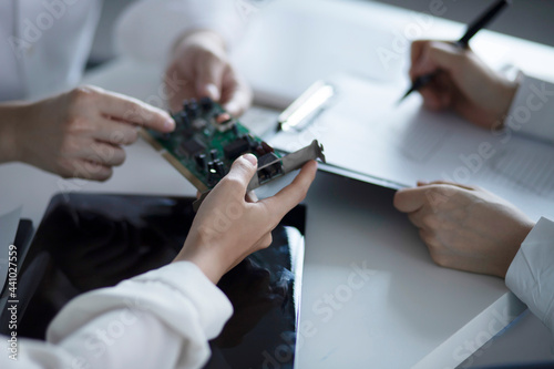 Engineers meeting with mother board 
