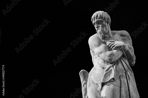 Elderly man statue symbolizes the winter season and the old age. Monument erected in the early 17th century on the Holy Trinity Bridge in Florence (Black and White with copy space)