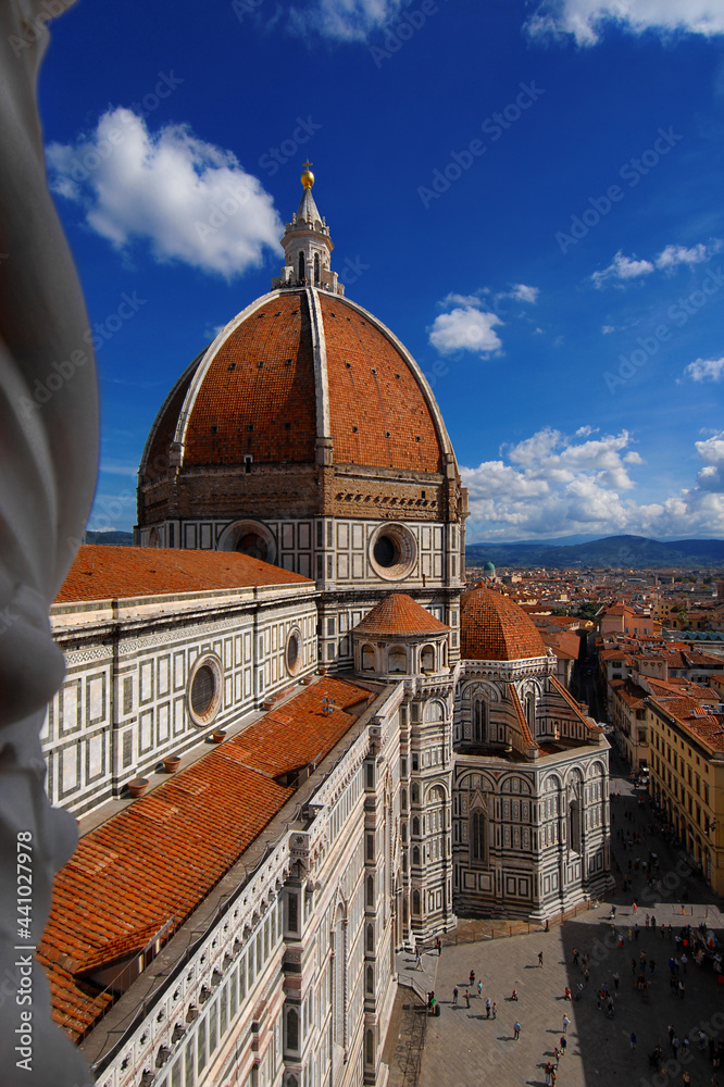 View of dome of Santa Maria del Fiore (St Mary of the Flower) in Florence with tourists at the top, built by italian architect Brunelleschi in the 15th century, a symbol of Renaissance in the world