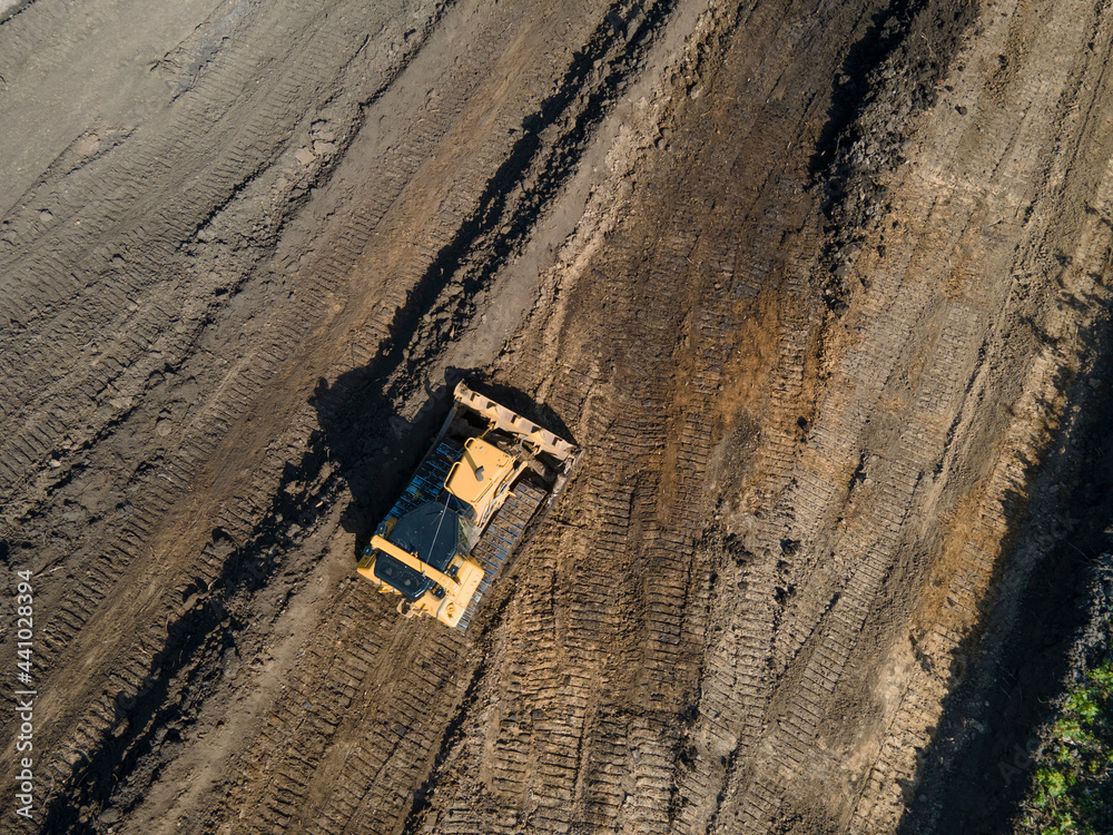 Crawler excavator top view digging on construction site Crawler excavator top view digging on construction site