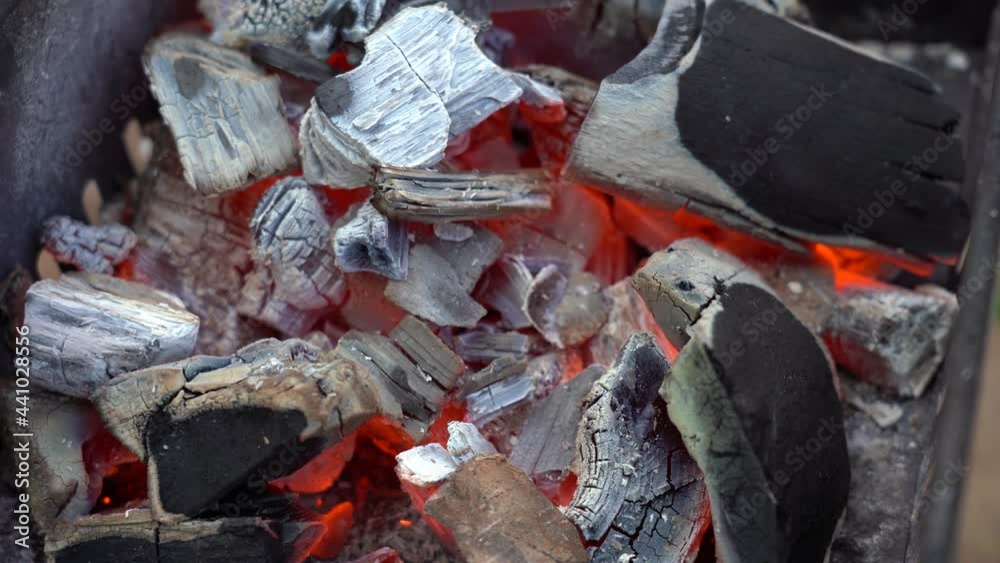 grill preparation concept. close-up of hot coals on the grill during the day. nobody. grill preparation concept. close-up of hot coals on the grill during the day. nobody.