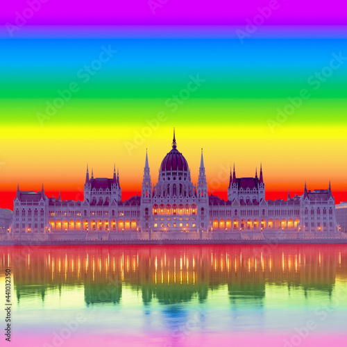 Hungary, lGBT rainbow pride sunset over Parliament building in Budapest. Composite concept image. Country politicians pass law banning LGBT content for children, minors.