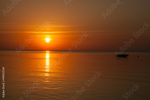 Summer sunset at sea. A resort place to relax at sunset. text place. © Natalija