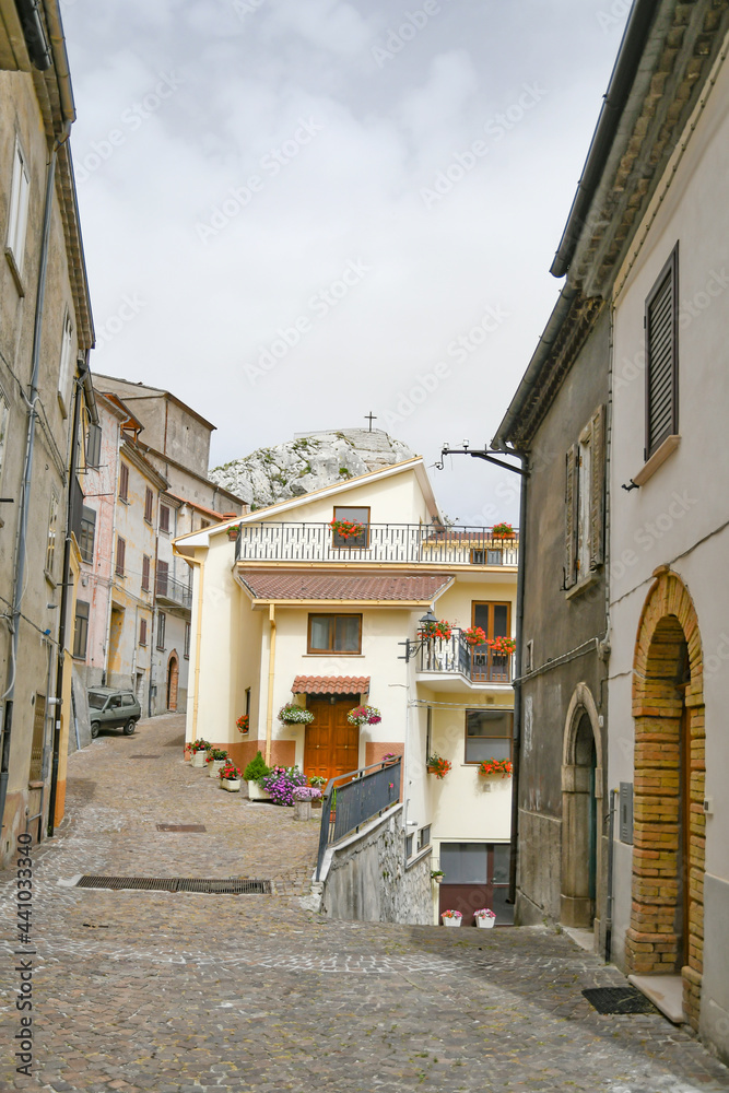 A small street between the old houses of Pietrabbondante, a medieval village in the mountains of the Molise region in Italy.