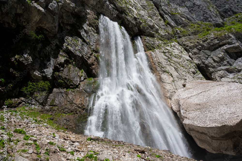Geghsky waterfall in the mountains of the Republic of Abkhazia. Clear sunny day May 14, 2021