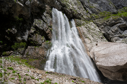 Geghsky waterfall in the mountains of the Republic of Abkhazia. Clear sunny day May 14, 2021