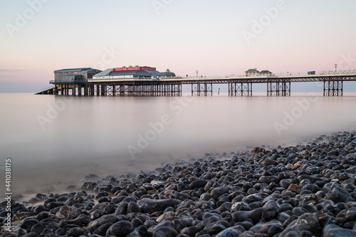 Cromer pier seen over the pebble beach © Jason Wells