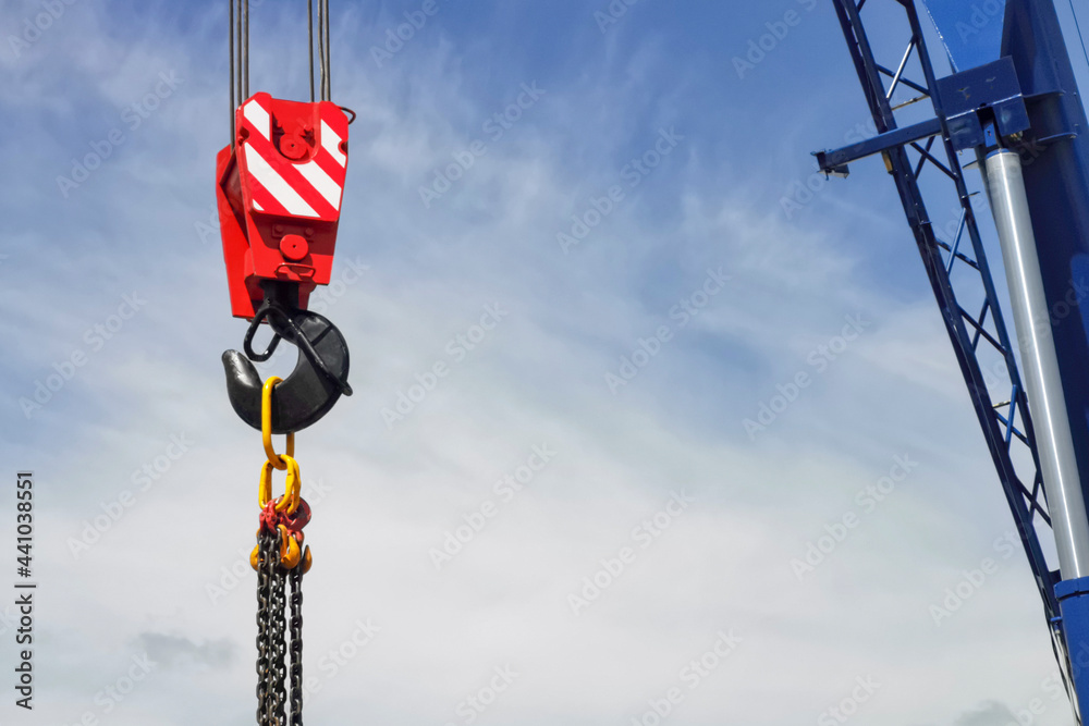 crane hook on blue sky background, construction work concept crane hook on blue sky background, construction work concept
