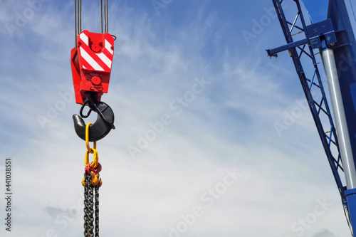 crane hook on blue sky background, construction work concept