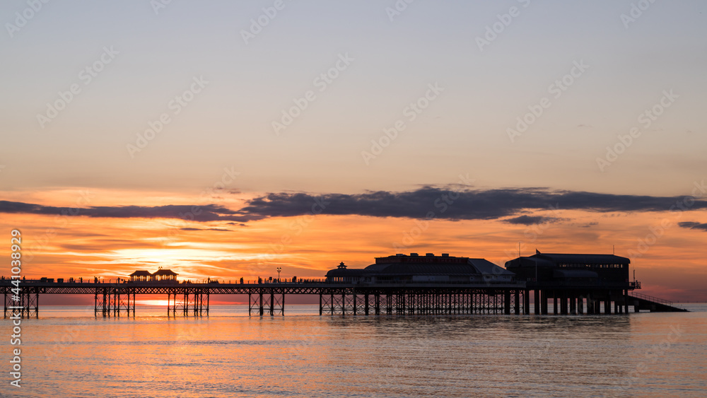 Sunset behind Cromer Pier