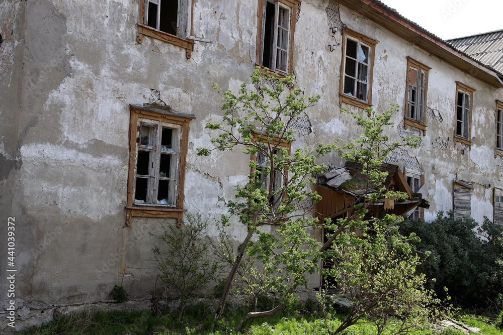 houses abandoned by people with broken windows and doors