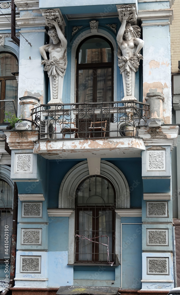 Facade of an old building with a balcony