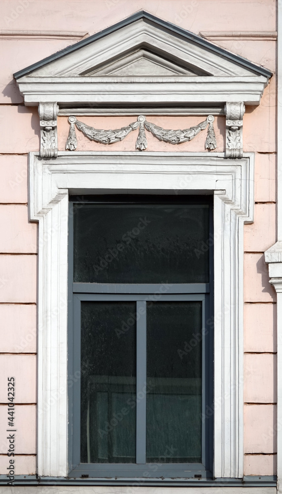 Facade of an old building with a window Facade of an old building with a window