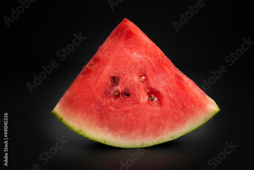 slices of watermelon isolated on black background