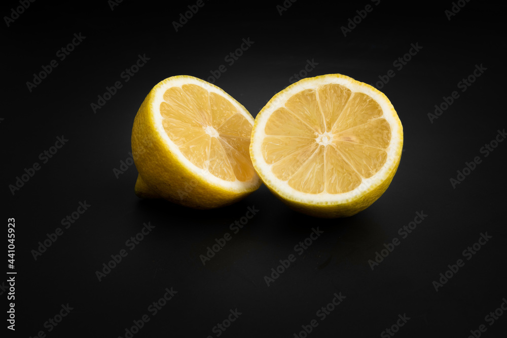 bright lemon yellow juicy fruit on a dark background bright lemon yellow juicy fruit on a dark background
