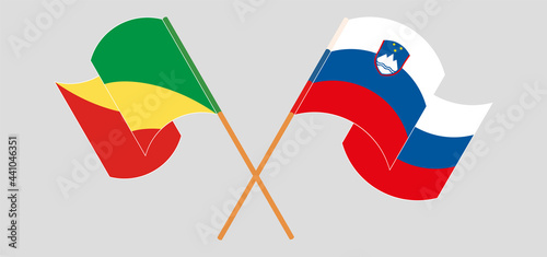 Crossed and waving flags of Republic of the Congo and Slovenia