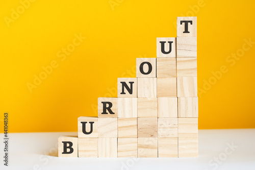 the word burnout is written on a wooden cubes, concept