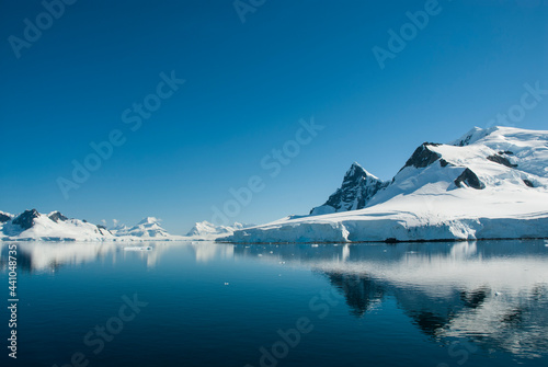 Snowy mountains in Paraiso Bay, Antartica.