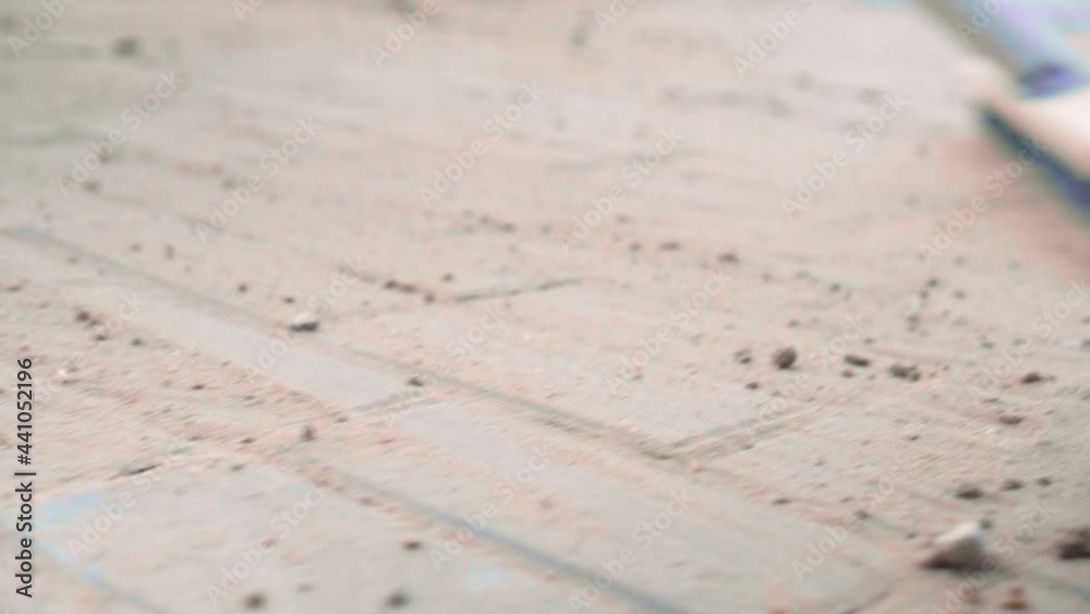 The final stage of laying paving slabs is the filling of gaps with dry