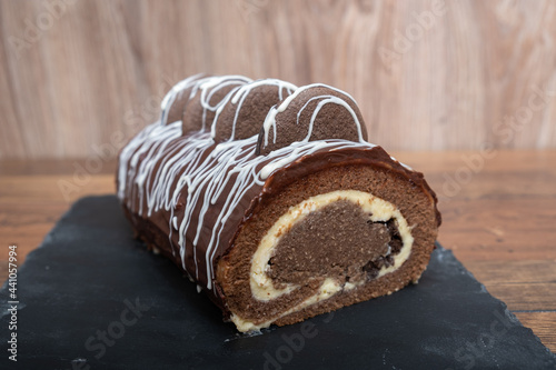 Chocolate Vanilla Swiss Roll Cake coated with Chocolate Chips