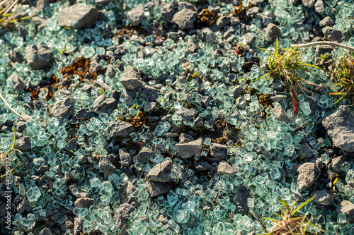 Broken pieces of car glass on the ground. Abstract car accident.Car accident scene.