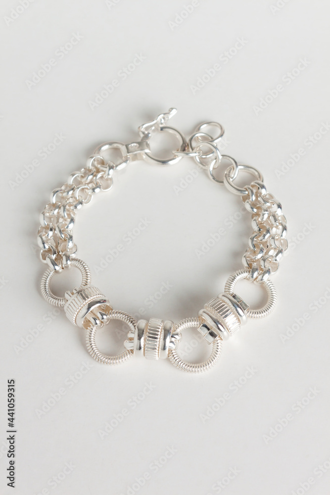 silver necklace on white silver necklace on white