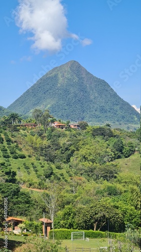 Landscape of cerro tusa with blue sky. The landscape of the municipality of Venice headed by Cerro Tusa  a unique mountain in the world for its pyramid shape. Venecia  Antioquia  Colombia.