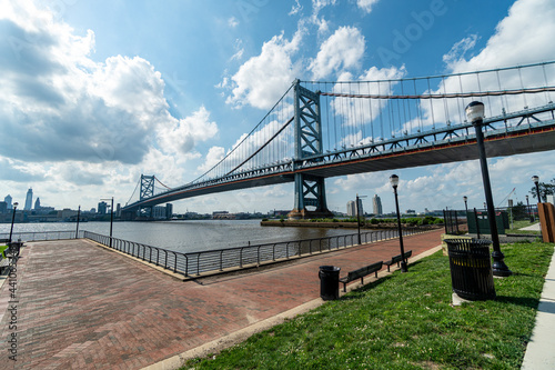 The Benjamin Franklin Bridge and Philadelphia, PA.  The bridge connects Camden, NJ to Philadelphia, PA.  The image is the view as seen from the Camden, NJ side.  photo