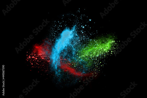 abstract colored dust explosion on a black background.abstract powder splatted background,Freeze motion of color powder exploding/throwing color powder, multicolored glitter texture.