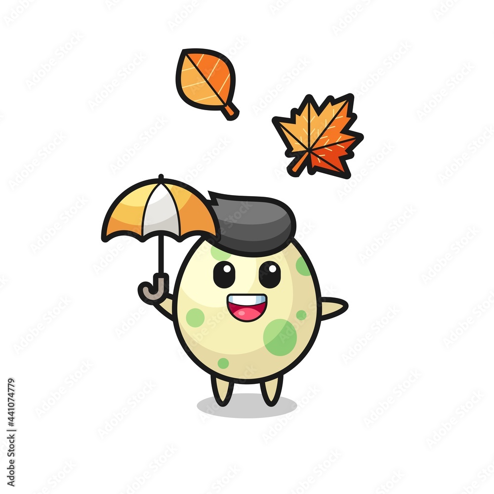 cartoon of the cute spotted egg holding an umbrella in autumn cartoon of the cute spotted egg holding an umbrella in autumn