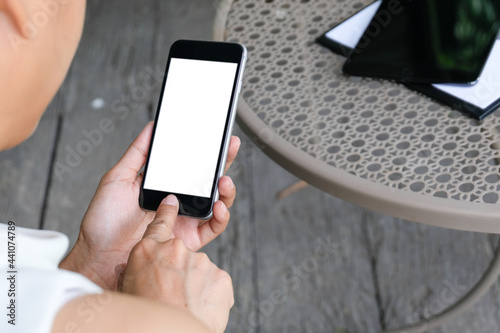 Businessman showing blank business card and holding smart phone..Business man holding white blank card space for text. product display