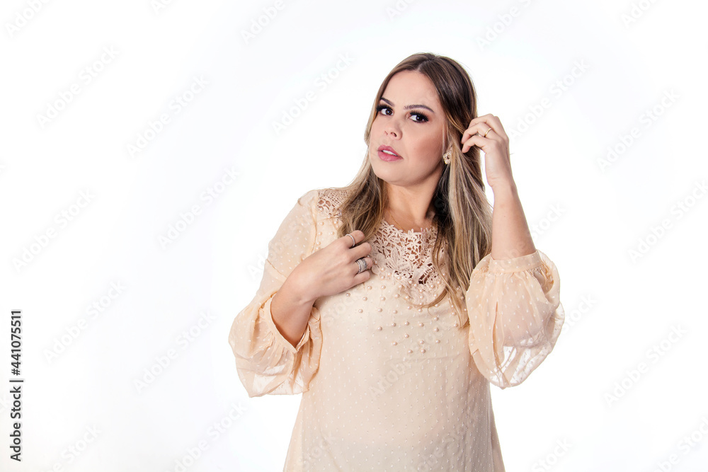 blonde woman on white background with hand in hair blonde woman on white background with hand in hair