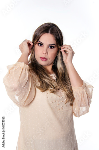 blonde woman on white background with hand in hair