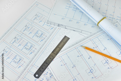Printed electrical diagrams, top view. Construction, electrical or engineering concept. Wiring diagram, ruler and pencil